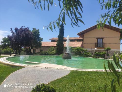 a fountain in the yard of a house at Finca La Calancha in Cuerva