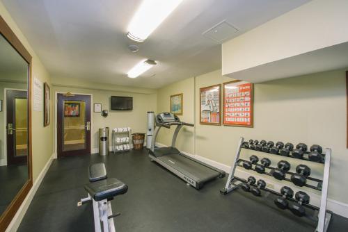a gym with dumbbells and weights in a room at Holiday Inn Express and Suites Merrimack by IHG in Merrimack