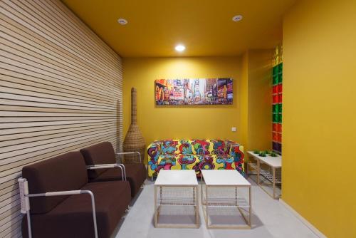 a living room with a couch and a table at Sleeport in Dnipro