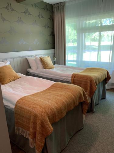 Postel nebo postele na pokoji v ubytování Öster Malma Hotel