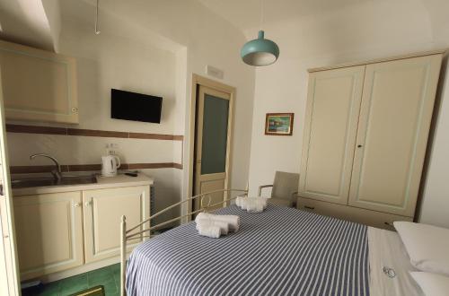 a bedroom with a bed with towels on it at CETARA - ALBERGO DIFFUSO in Cetara