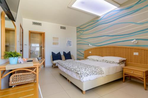 Ein Bett oder Betten in einem Zimmer der Unterkunft Hotel Mandetta - Adults Only