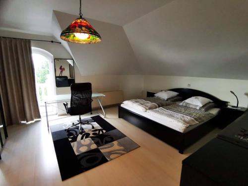 a bedroom with a bed and a table and a lamp at Homburg in Limbach