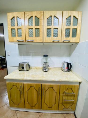 a counter in a kitchen with a counter top at Cabañas Del Maule II in Talca