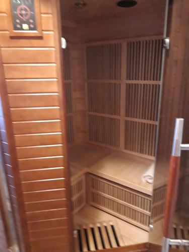 an empty room with wooden walls and chairs in a room at Rodinný pension U Soudku in Rudník