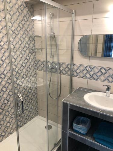 a bathroom with a shower and a sink at Villa Capraghjese in Galeria