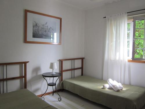 Кровать или кровати в номере Aldeia da Encosta