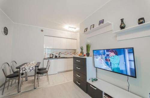 A television and/or entertainment center at Apartament Thomas 2