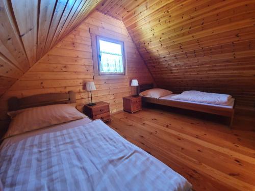 מיטה או מיטות בחדר ב-Anna i Halina