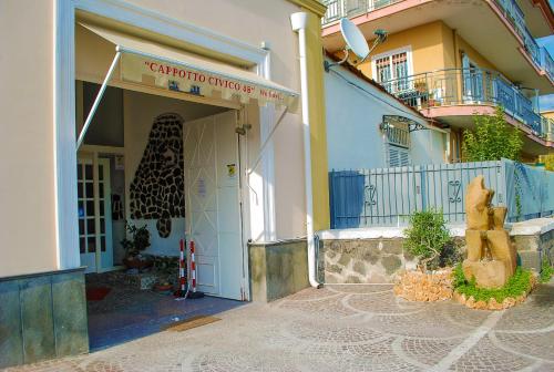 a entrance to a building with a sign on it at B&B Cappotto civico 48 in Pompei