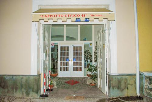 an entrance to a building with a door open at B&B Cappotto civico 48 in Pompei