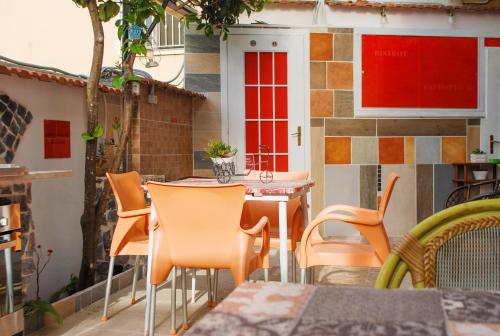 a patio with a table and chairs on a patio at B&B Cappotto civico 48 in Pompei