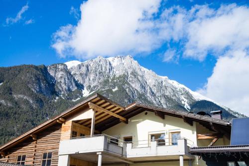 a ski lodge with a mountain in the background at Bergjuwel in Nassereith