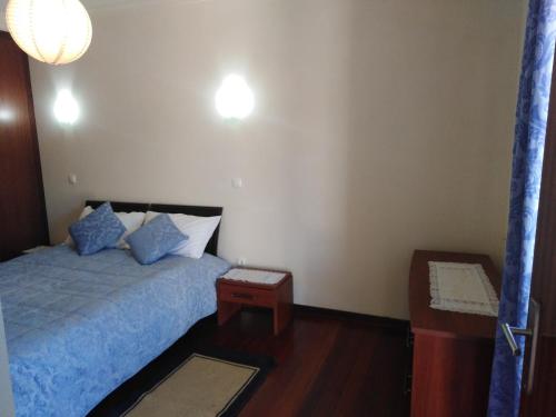 Ein Bett oder Betten in einem Zimmer der Unterkunft Ares Vieira