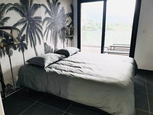 Ένα ή περισσότερα κρεβάτια σε δωμάτιο στο Appartement 2 pièces dans le centre historique de Porto Vecchio