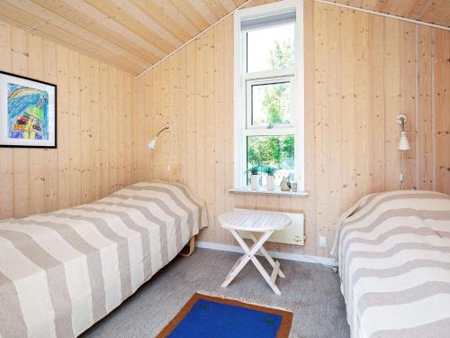 Postel nebo postele na pokoji v ubytování Three-Bedroom Holiday home in Otterup 4