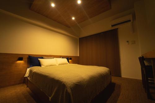 a bedroom with a large bed in a room at HIT Tenjin in Fukuoka