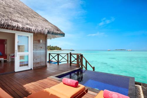 a resort deck with a plunge pool and the ocean at Sun Siyam Vilu Reef - 24 Hours All-Inclusive with Free Transfer in Dhaalu Atoll