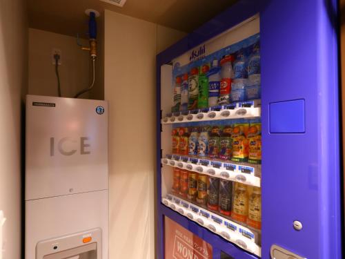 an ice machine in a store with soda at Hotel Wing International Select Ikebukuro in Tokyo