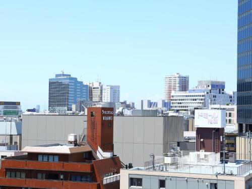 a view of a city skyline with tall buildings at Hotel Wing International Select Ikebukuro in Tokyo