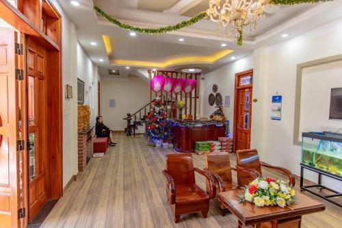 a lobby of a store with a christmas tree at Anh Trang Homestay in Da Lat