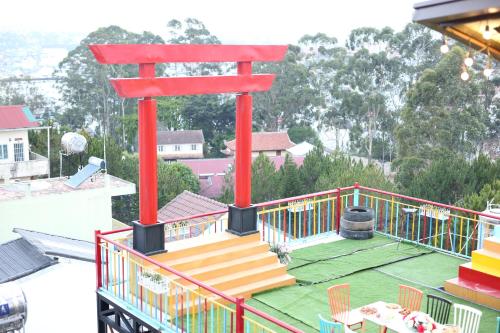 a large red structure on the roof of a house at Anh Trang Homestay in Da Lat