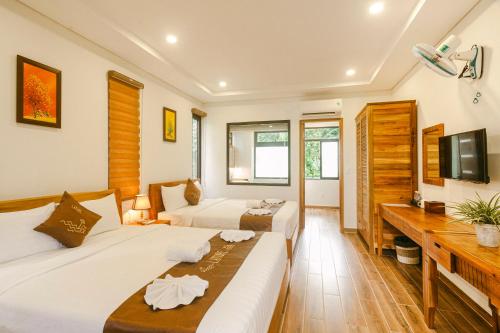 Giường trong phòng chung tại La Nube Residence