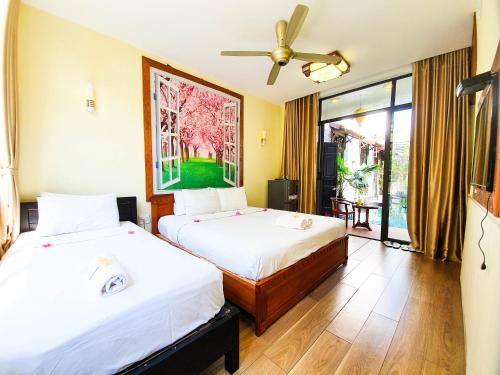 Giường trong phòng chung tại Anh Family Homestay