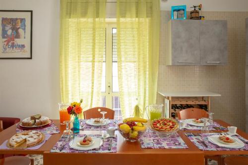a table with food on it in a kitchen at Anna e Augusto B&B in Lucera