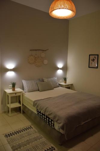 Un pat sau paturi într-o cameră la Idan Lodge in the Arava
