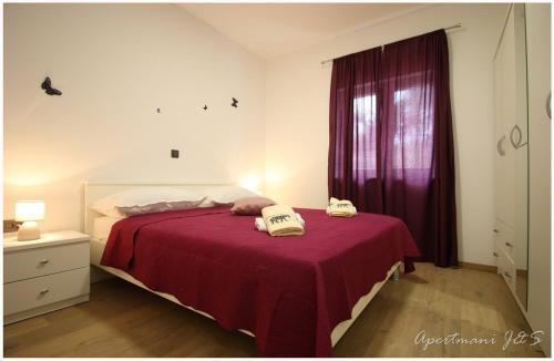 Postel nebo postele na pokoji v ubytování Apartmani Jere&Sara