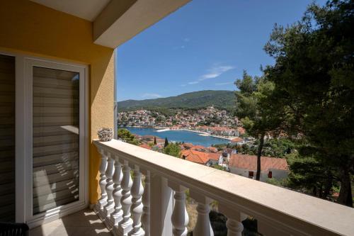 a view from a balcony of a balcony overlooking a city at Villa Vista in Jelsa