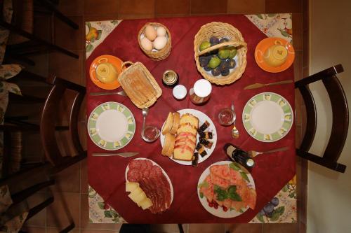 a table with plates of food on it at MacchiaPiana in Scansano