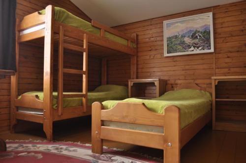 a bedroom with two bunk beds in a cabin at Рада Дараба in Krasnik
