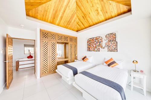 Postel nebo postele na pokoji v ubytování Villa Jaliza - Chaweng Noi