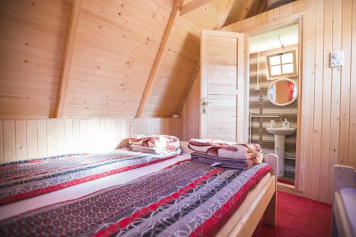 Säng eller sängar i ett rum på Rafting Center Drina Tara