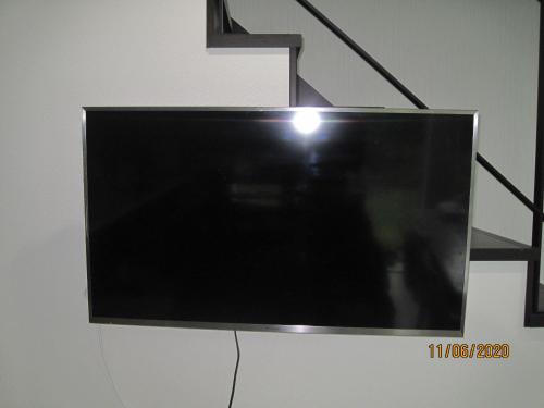 Una televisión o centro de entretenimiento en Cloud9 広い空間 リゾート徒歩5分 Aircon LINE割ID dolry70