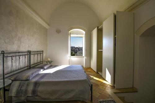 Postel nebo postele na pokoji v ubytování B&B Il Palazzotto del Caveoso