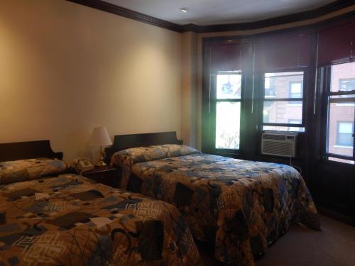 Кровать или кровати в номере Hotel 31 Extended Stay