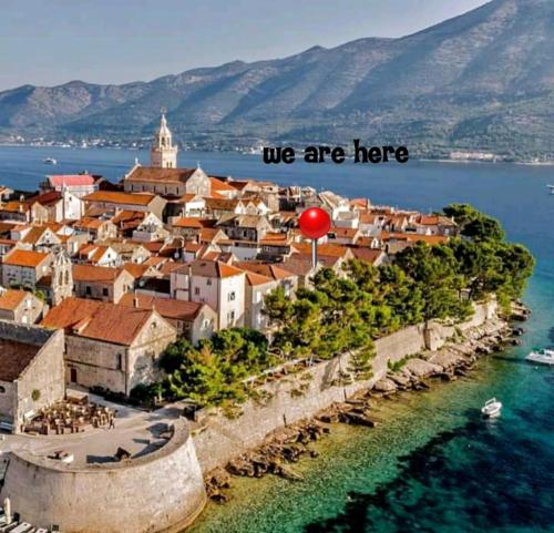 a town on the shore of a body of water at Old Town Sea Front M&M Apartment Korčula in Korčula