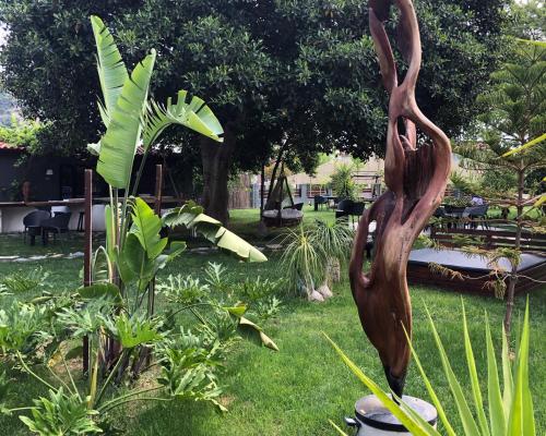 a statue in the grass in a garden at Murat Pasha Mansion in Dalyan