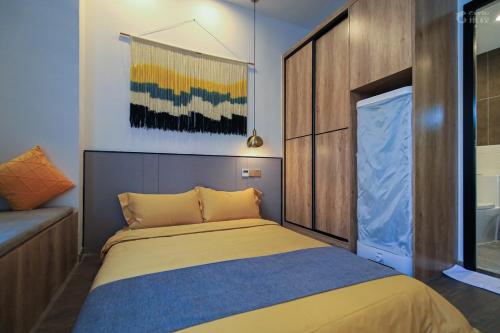Shenzhen Ruiya Japanese-style Hotel Huaqiang Northにあるベッド