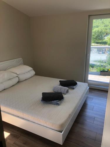 a room with a bed with two towels on it at Jølster Holiday home in Skei 