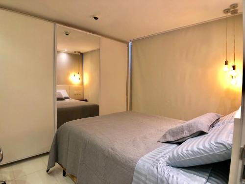 Кровать или кровати в номере Flat Jd Goiás