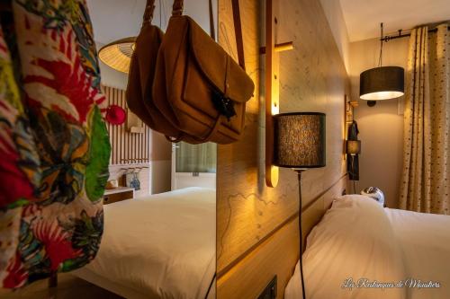 a bedroom with a bed with a bunch of bananas on the wall at Hotel Les Restanques De Moustiers in Moustiers-Sainte-Marie