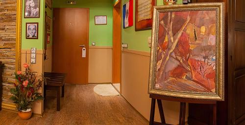 a hallway with a large painting on the wall at Diplomat Plaza Hotel & Resort in Lukovit