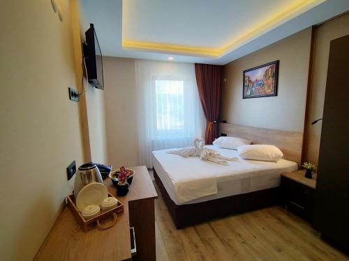 Letto o letti in una camera di Palmiye Royale Palace