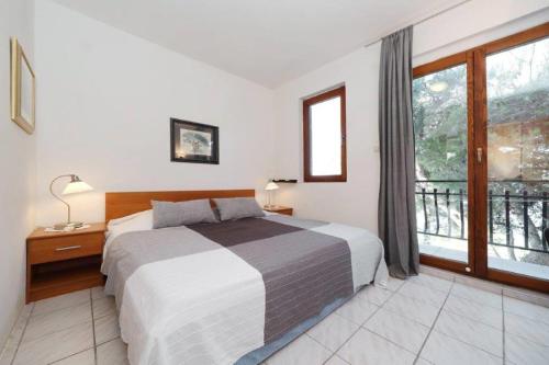 Posteľ alebo postele v izbe v ubytovaní Murter Pod Raduč apartman
