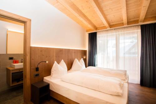 Llit o llits en una habitació de App Piz de Plaies -ciasa Lavarella