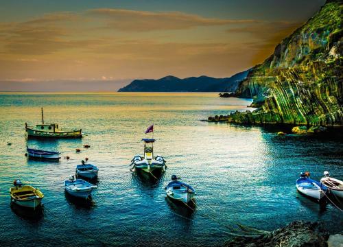 a group of boats in a body of water at Una Finestra sul Mare - Free Wi -Fi in Riomaggiore